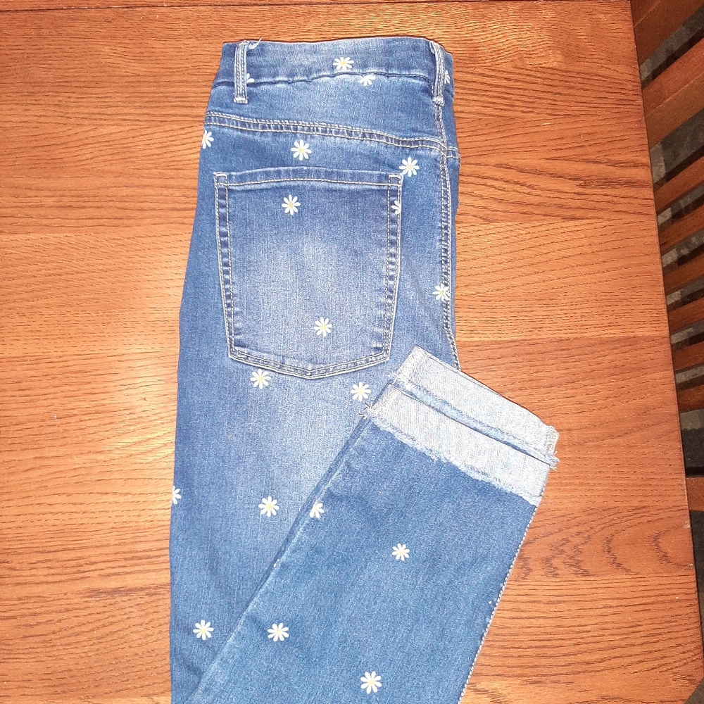 Jeans with tiny daisies.